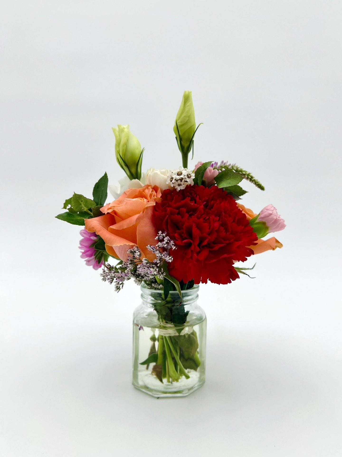 A colourful bouquet in a glass vase. Same-day delivery in Melbourne.