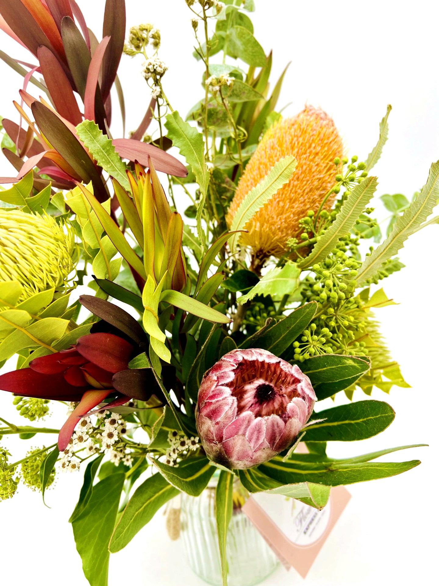 Medium Native Mix Jar displaying a captivating assortment of native flowers and foliage