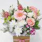 Pink and white flowers arranged in a kraft box with a pink ribbon, perfect for gifting and decorating, available for delivery in Melbourne, VIC.
