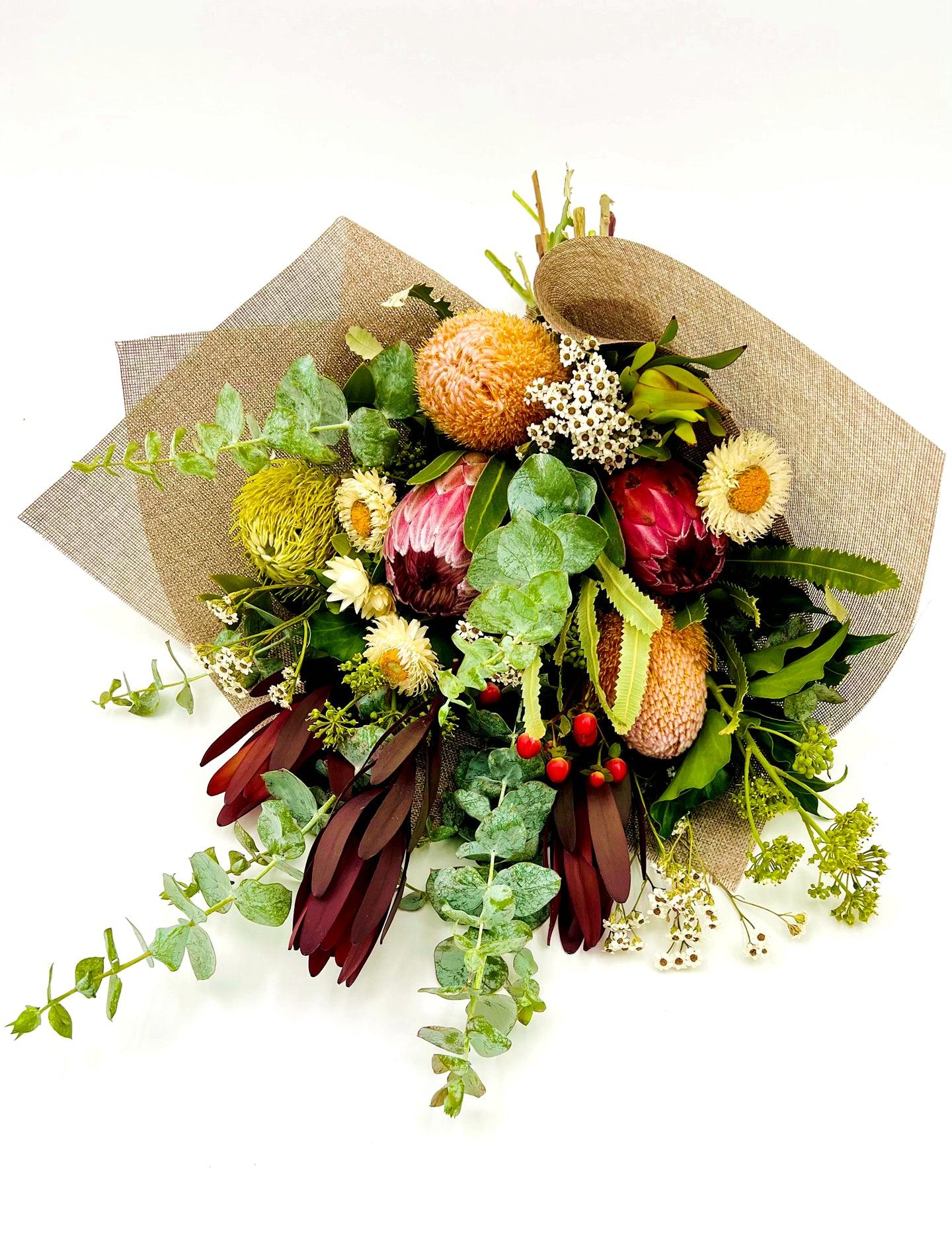 This large native flower bouquet is a true showstopper! With its vibrant colours and lush greenery, it's sure to make any recipient feel special.