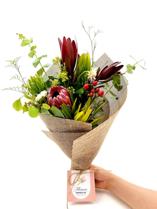 Small Native Mix Bouquet with lush Australian native flowers in a jute feel wrap.