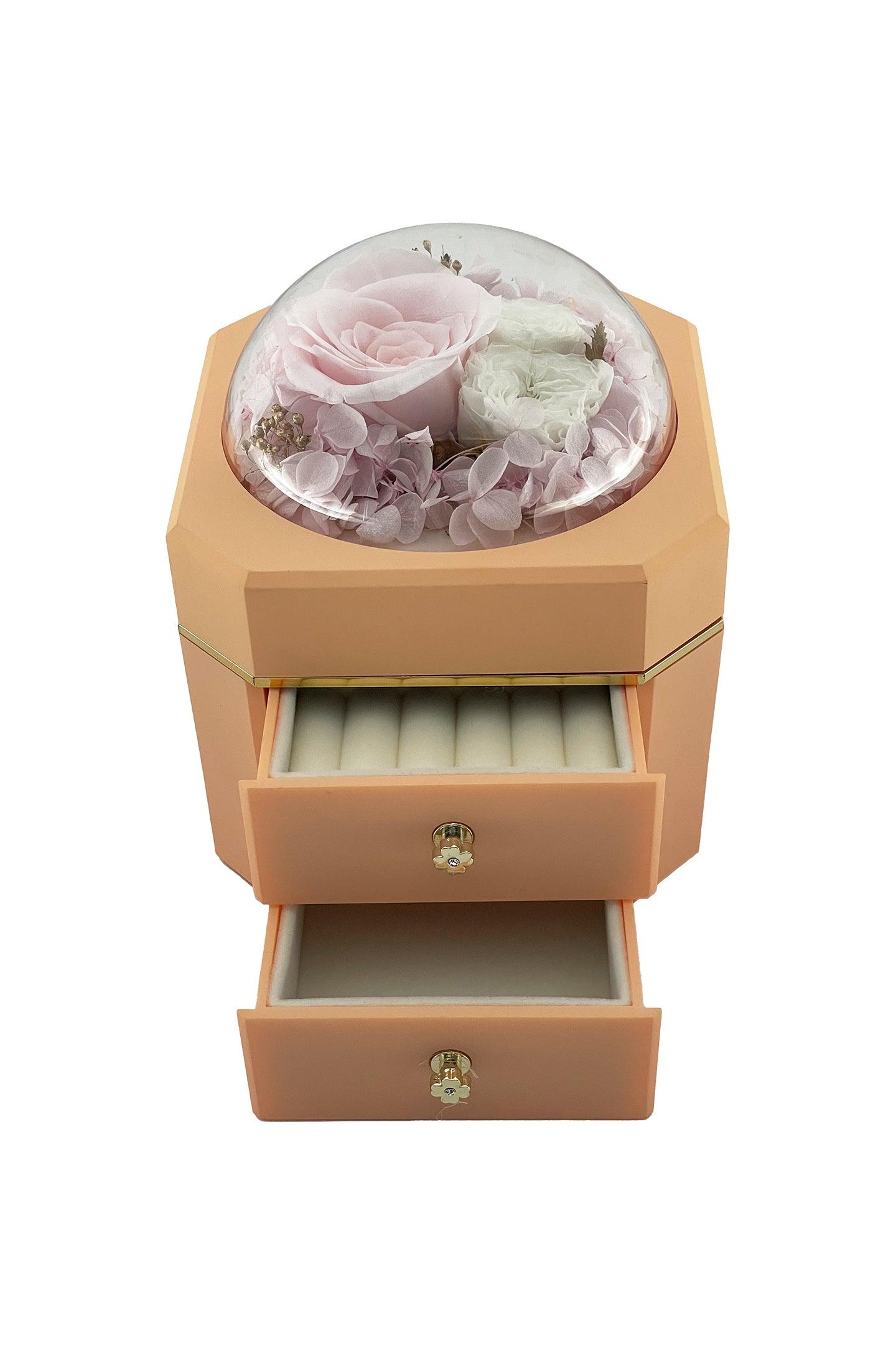 Preserved pink rose, two white flowers, and pink hydrangea petals in a duo-drawer jewellery box with a pinkish tan colour. Same-day delivery is available in Melbourne, VIC, Australia.